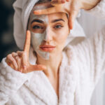 Portrait of a woman with a facial mask half face